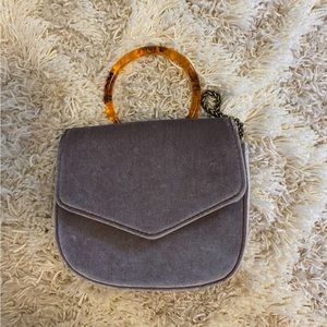 Anthropologie Lucite-Handled Ring Bag in Mauve